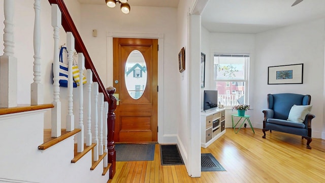 25 Nevens St Unit 1, Portland, ME 04103 - foyer entrance featuring stairway, light wood-style floors, and baseboards
