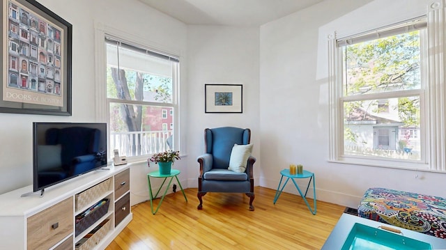 25 Nevens St Unit 1, Portland, ME 04103 - sitting room featuring healthy amount of natural light and wood finished floors