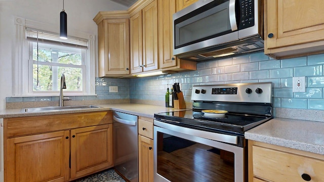 25 Nevens St Unit 1, Portland, ME 04103 - kitchen featuring stainless steel appliances, a sink, backsplash, pendant lighting, and light brown cabinetry
