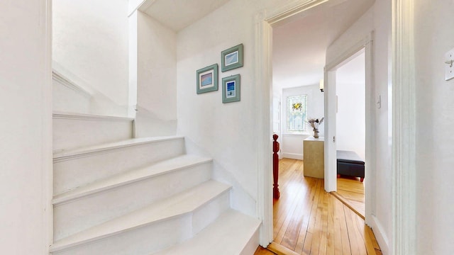 25 Nevens St Unit 1, Portland, ME 04103 - staircase featuring hardwood / wood-style flooring and baseboards