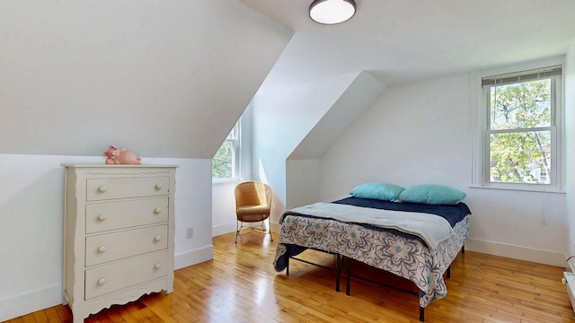 25 Nevens St Unit 1, Portland, ME 04103 - bedroom with light wood finished floors, lofted ceiling, and baseboards