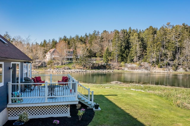 view of yard featuring a deck with water view