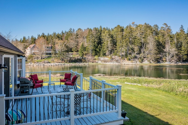 deck featuring a water view and a yard