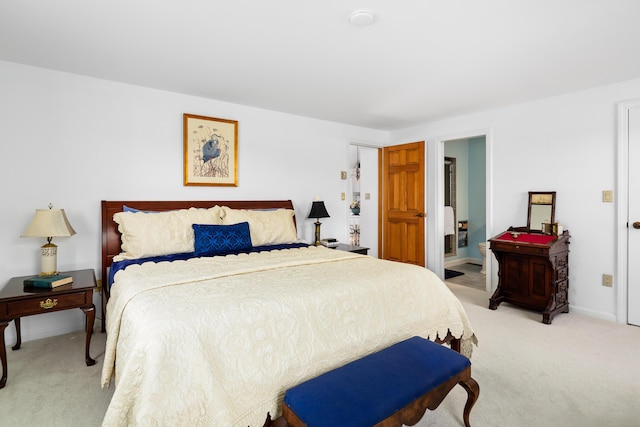 bedroom featuring light colored carpet and baseboards