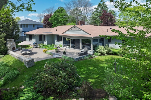 69 Brookside Rd, Portland, ME 04103 - rear view of property with a patio, a yard, a chimney, and a shingled roof