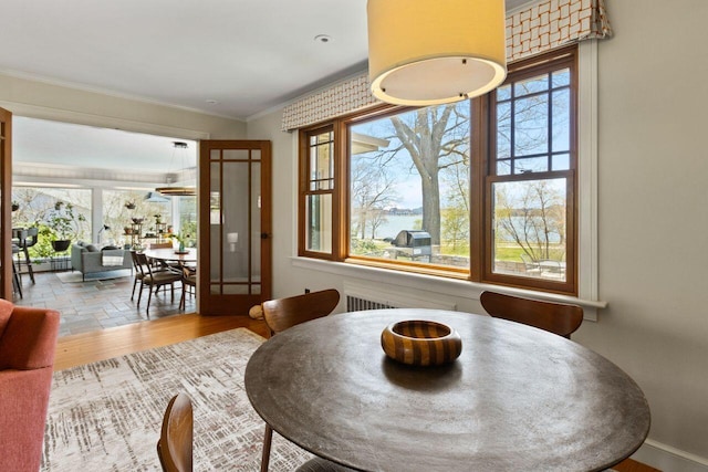 69 Brookside Rd, Portland, ME 04103 - dining space featuring healthy amount of natural light, crown molding, and wood finished floors