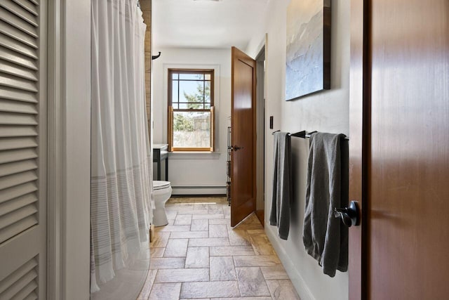 69 Brookside Rd, Portland, ME 04103 - bathroom with a baseboard heating unit, toilet, baseboards, and stone finish floors