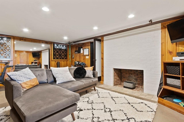 69 Brookside Rd, Portland, ME 04103 - living room featuring wood walls, recessed lighting, and a fireplace