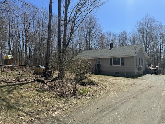 76 Norton Hill Rd, Dover-Foxcroft, ME 04426 - ranch-style house featuring roof with shingles, dirt driveway, and a chimney
