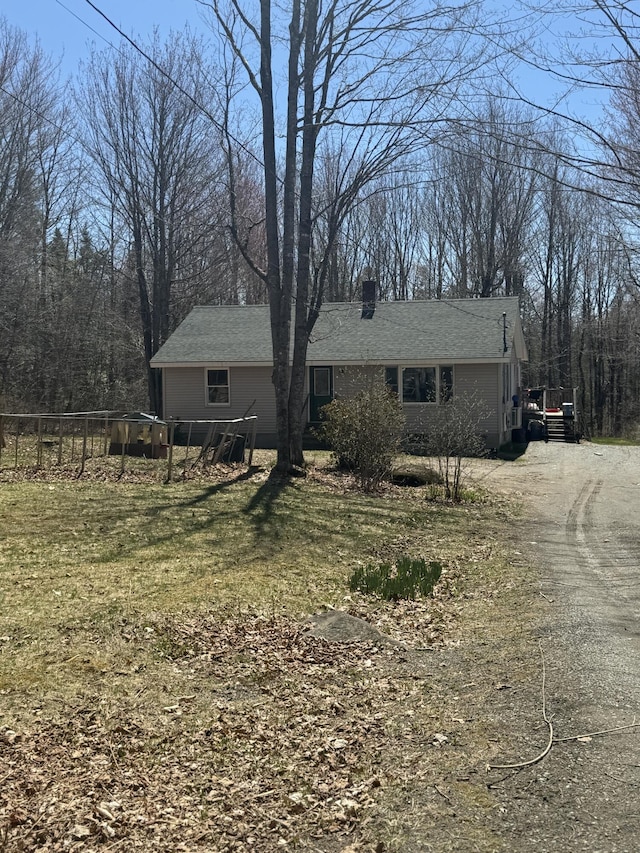 76 Norton Hill Rd, Dover-Foxcroft, ME 04426 - single story home with a chimney and dirt driveway