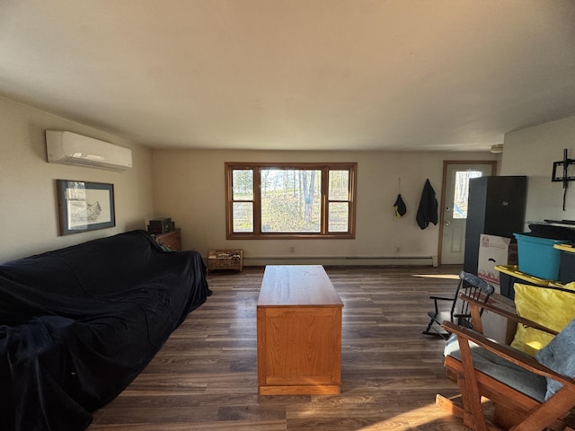 76 Norton Hill Rd, Dover-Foxcroft, ME 04426 - living room featuring dark wood finished floors and a wall unit AC