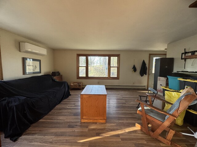 76 Norton Hill Rd, Dover-Foxcroft, ME 04426 - living room with dark wood-type flooring, a baseboard radiator, and a wall mounted AC