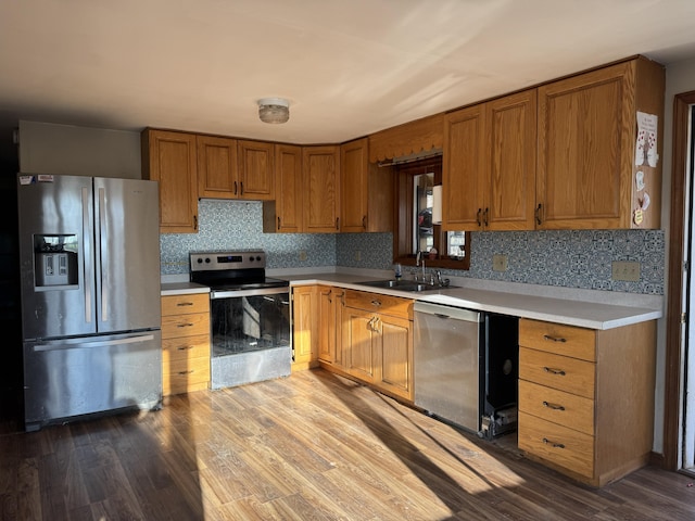 76 Norton Hill Rd, Dover-Foxcroft, ME 04426 - kitchen featuring light countertops, stainless steel appliances, a sink, and dark wood-type flooring
