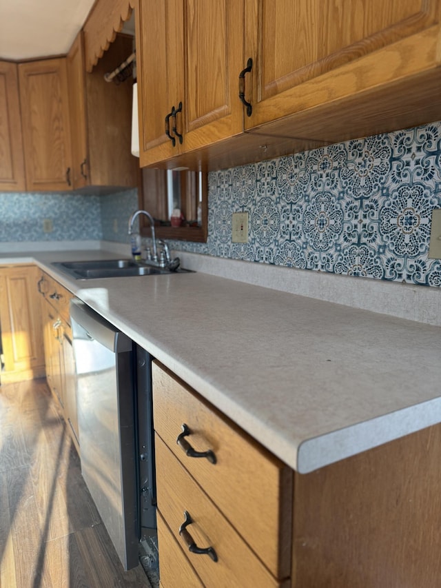 76 Norton Hill Rd, Dover-Foxcroft, ME 04426 - kitchen with brown cabinetry, a sink, dishwasher, and light countertops