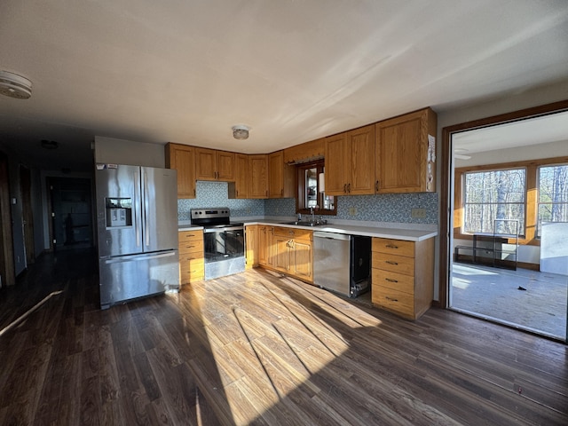 76 Norton Hill Rd, Dover-Foxcroft, ME 04426 - kitchen featuring a sink, appliances with stainless steel finishes, dark wood finished floors, and light countertops