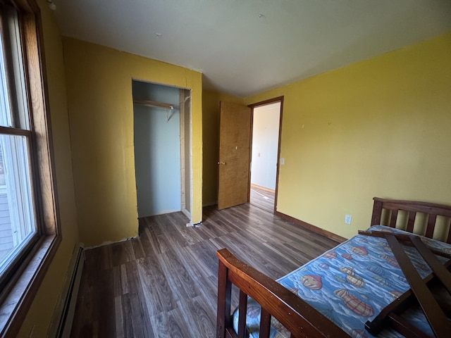 76 Norton Hill Rd, Dover-Foxcroft, ME 04426 - bedroom with wood finished floors and baseboard heating