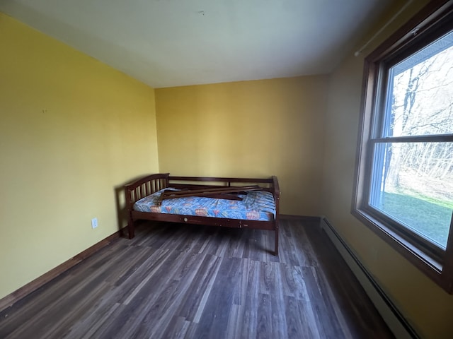 76 Norton Hill Rd, Dover-Foxcroft, ME 04426 - bedroom featuring baseboards, a baseboard heating unit, and wood finished floors