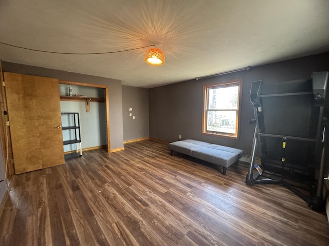 76 Norton Hill Rd, Dover-Foxcroft, ME 04426 - unfurnished bedroom with baseboards, wood finished floors, and a closet