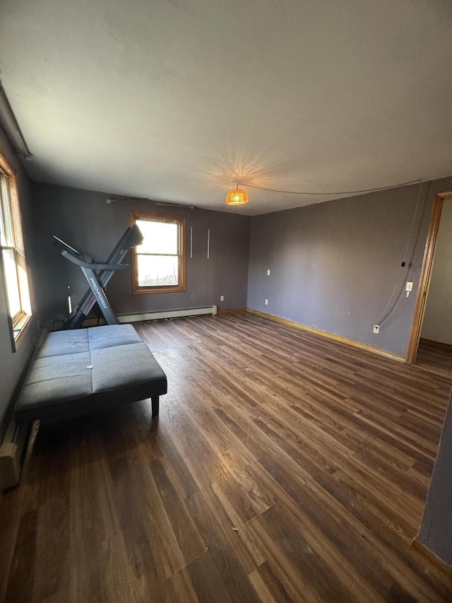 76 Norton Hill Rd, Dover-Foxcroft, ME 04426 - bedroom with baseboards, wood finished floors, and a baseboard radiator