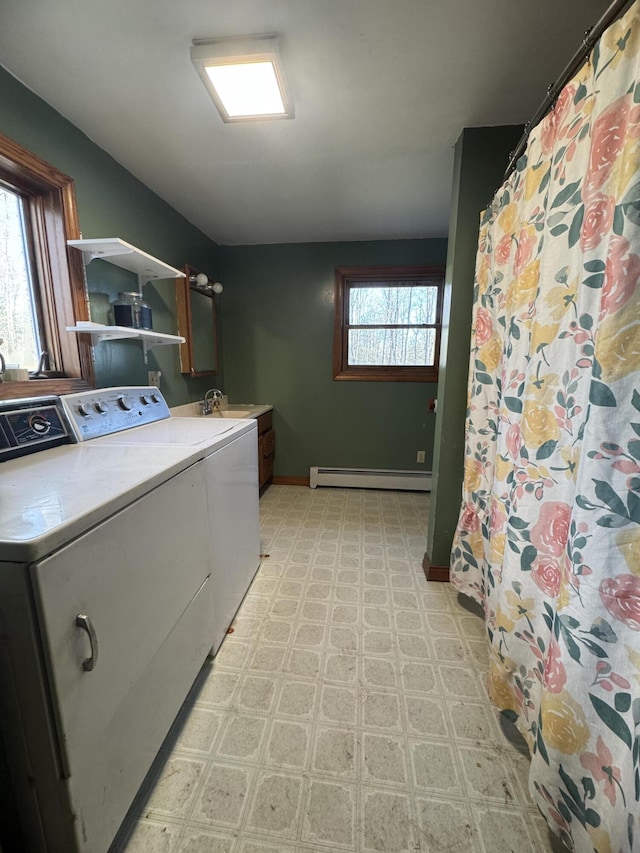76 Norton Hill Rd, Dover-Foxcroft, ME 04426 - laundry area featuring cabinet space, baseboards, light floors, a baseboard heating unit, and washer and clothes dryer