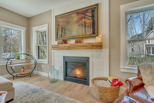 27 Oak Ridge Ter, Arundel, ME 04046 - living room featuring wood finished floors and a large fireplace
