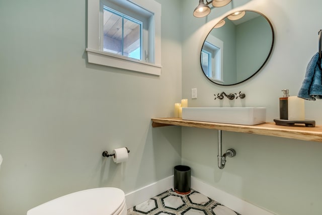 27 Oak Ridge Ter, Arundel, ME 04046 - half bathroom with a sink, toilet, and baseboards