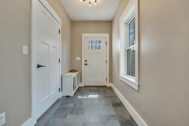 27 Oak Ridge Ter, Arundel, ME 04046 - doorway to outside featuring baseboards