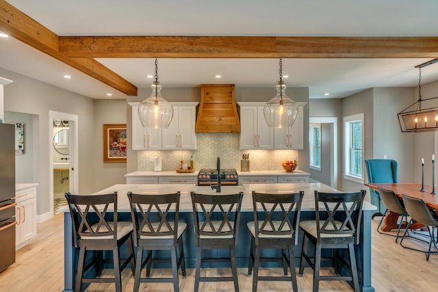 27 Oak Ridge Ter, Arundel, ME 04046 - dining area with light wood-type flooring, beamed ceiling, recessed lighting, baseboards, and a chandelier
