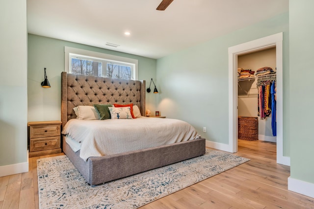 27 Oak Ridge Ter, Arundel, ME 04046 - bedroom with baseboards, wood finished floors, a spacious closet, and ceiling fan