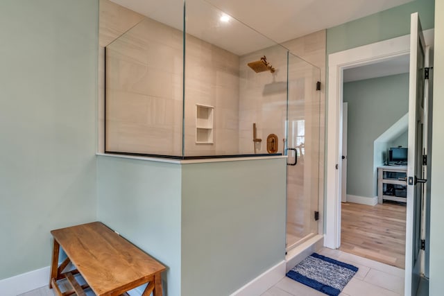 27 Oak Ridge Ter, Arundel, ME 04046 - bathroom featuring a stall shower, tile patterned floors, and baseboards
