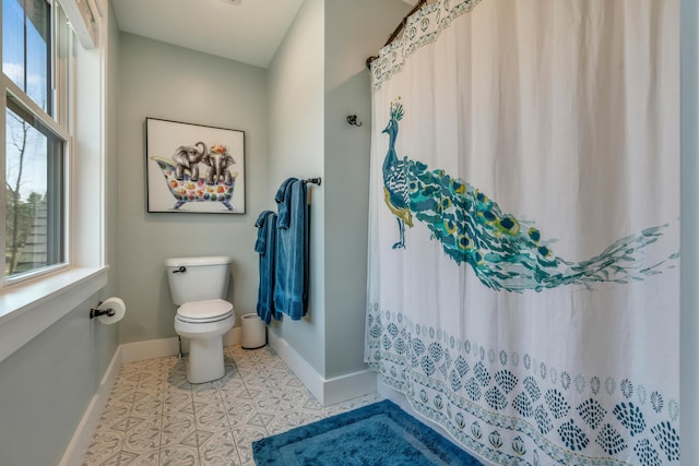27 Oak Ridge Ter, Arundel, ME 04046 - bathroom with baseboards, toilet, and curtained shower