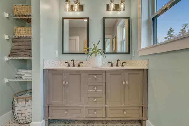 27 Oak Ridge Ter, Arundel, ME 04046 - full bath featuring plenty of natural light, baseboards, and double vanity