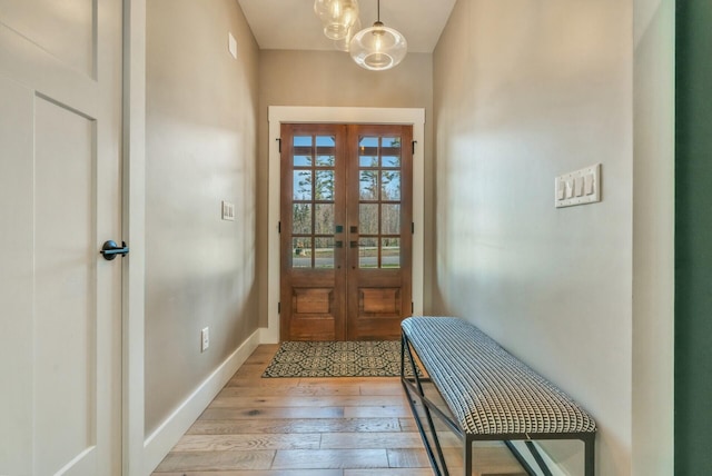 27 Oak Ridge Ter, Arundel, ME 04046 - entrance foyer with light wood finished floors, french doors, and baseboards