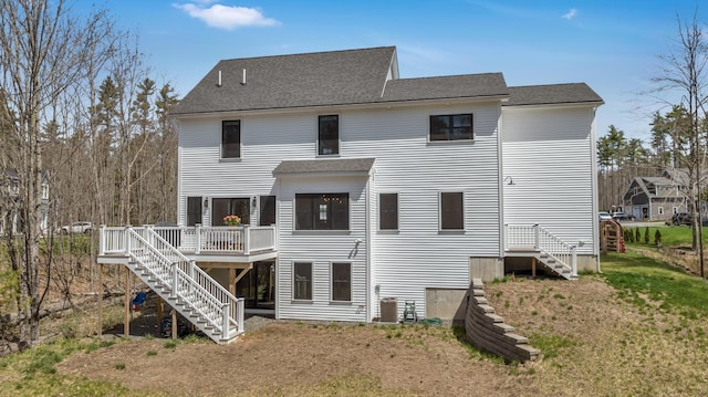 27 Oak Ridge Ter, Arundel, ME 04046 - rear view of house with stairs, a deck, a lawn, a shingled roof, and central air condition unit
