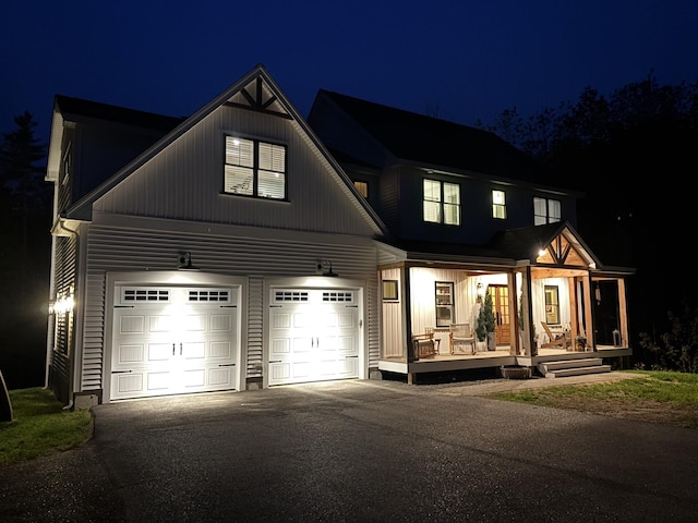 27 Oak Ridge Ter, Arundel, ME 04046 - modern farmhouse with a porch, driveway, and an attached garage