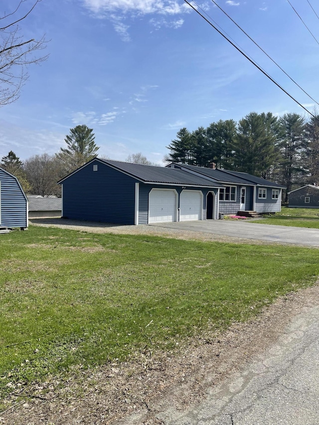 garage with aphalt driveway