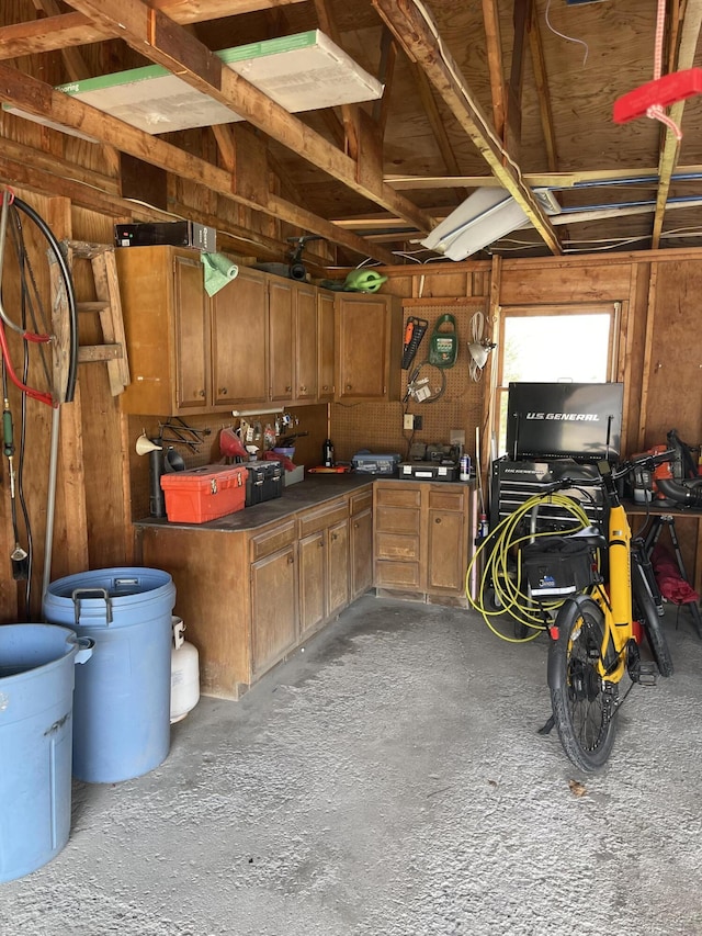 garage featuring wooden walls