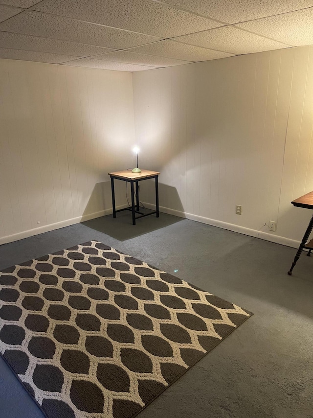 interior space with baseboards and carpet