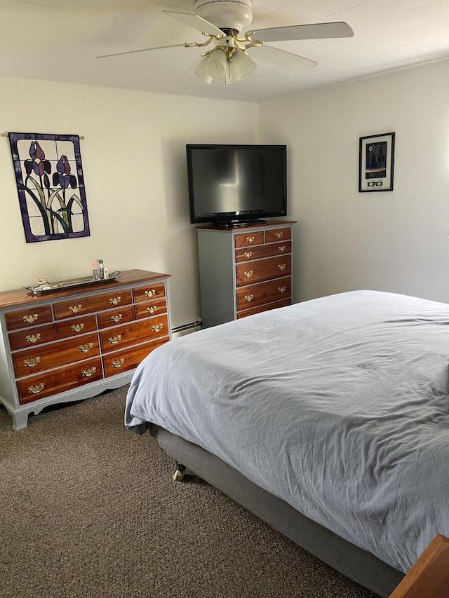 carpeted bedroom featuring a baseboard radiator and ceiling fan