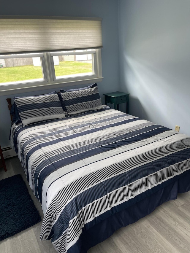 bedroom with wood finished floors