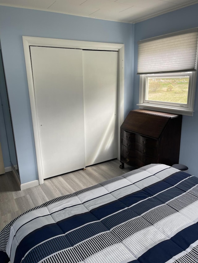 unfurnished bedroom featuring a closet and wood finished floors