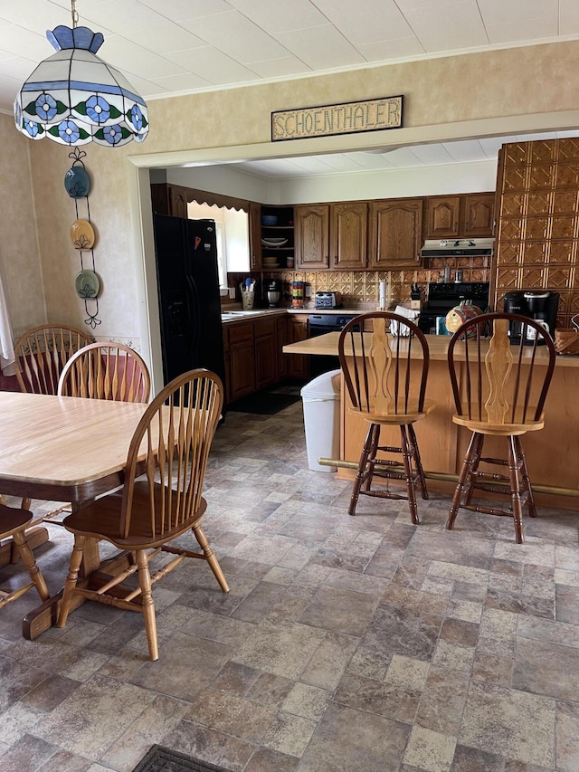 dining area with stone finish flooring