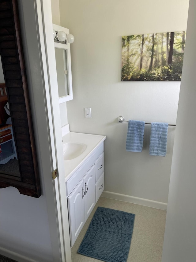 bathroom featuring vanity and baseboards