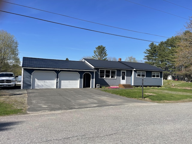 15 Patrick St, Skowhegan, ME 04976 - ranch-style house with an attached garage, a chimney, metal roof, a front yard, and driveway
