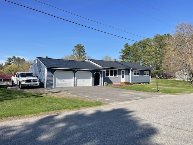 15 Patrick St, Skowhegan, ME 04976 - single story home featuring a front lawn, driveway, and an attached garage