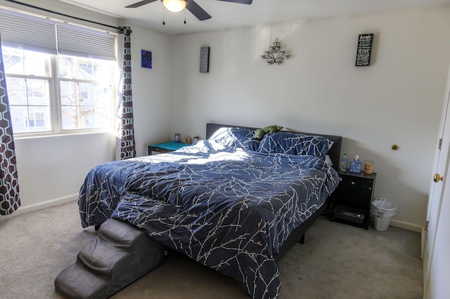 bedroom with baseboards, ceiling fan, and carpet