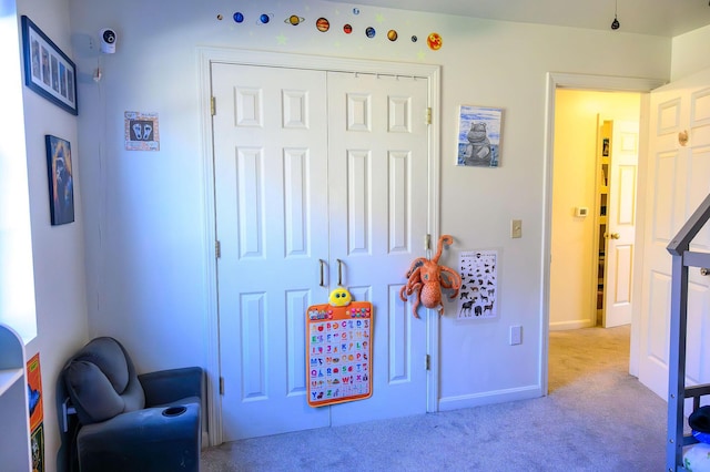 game room featuring carpet floors and baseboards