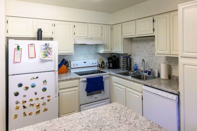 kitchen featuring a sink, under cabinet range hood, white appliances, and tasteful backsplash