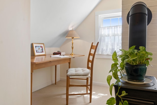 office area featuring baseboards, carpet, and lofted ceiling