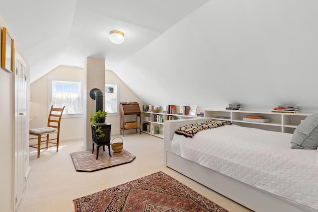 bedroom featuring carpet floors and vaulted ceiling